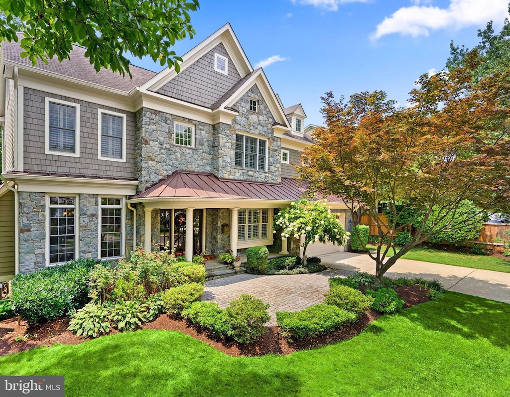 view of front of property with a patio area and a front yard