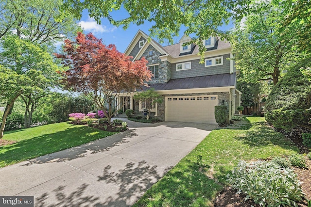 view of front of house with a garage and a front lawn