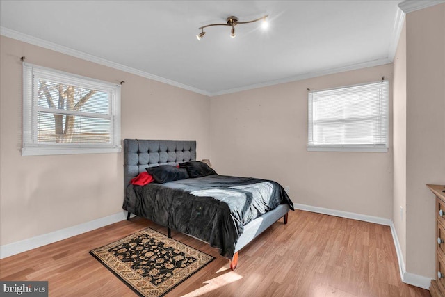 bedroom featuring light hardwood / wood-style floors and ornamental molding