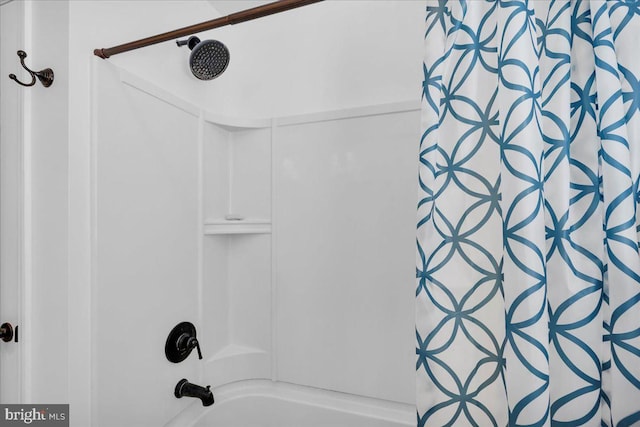 bathroom featuring washtub / shower combination