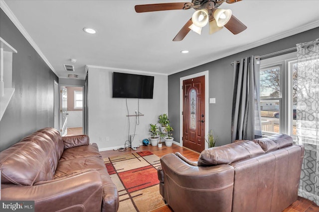 living room with ceiling fan, crown molding, and light hardwood / wood-style flooring