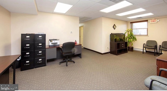 carpeted office featuring a paneled ceiling and a baseboard radiator