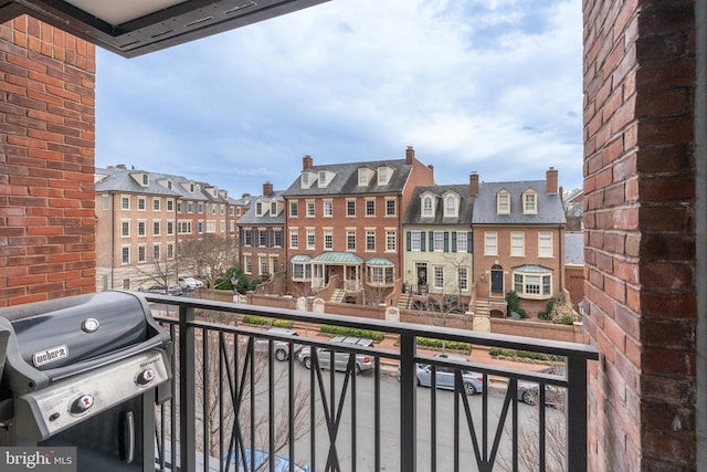 balcony featuring a residential view and grilling area