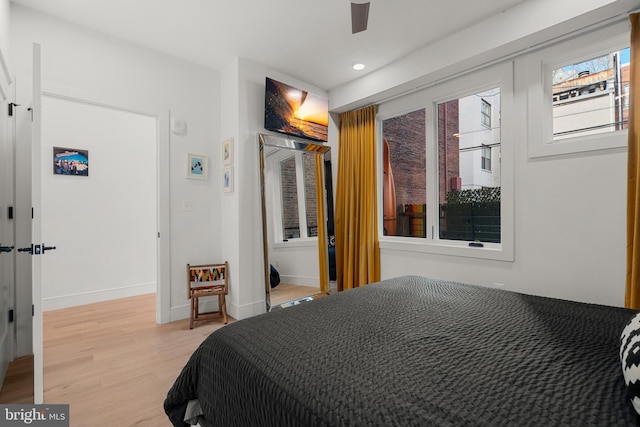 bedroom featuring ceiling fan and light hardwood / wood-style floors