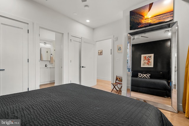 bedroom with light wood-type flooring