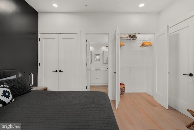 bedroom featuring light wood-type flooring