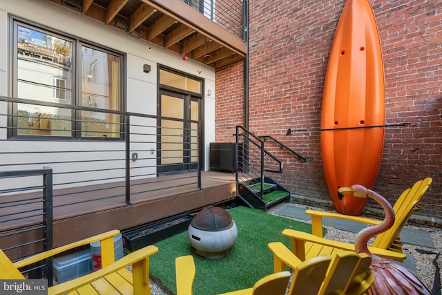 balcony featuring an outdoor fire pit