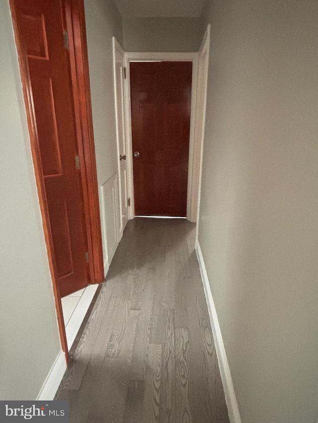 hallway with light hardwood / wood-style flooring