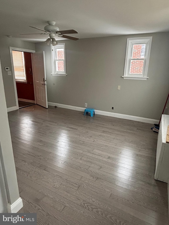 spare room with hardwood / wood-style flooring and ceiling fan