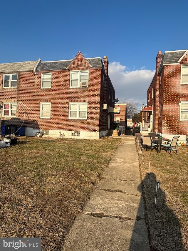 view of home's exterior with a yard