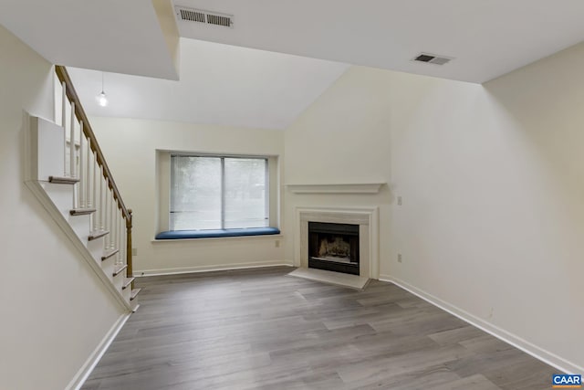 unfurnished living room with light hardwood / wood-style flooring