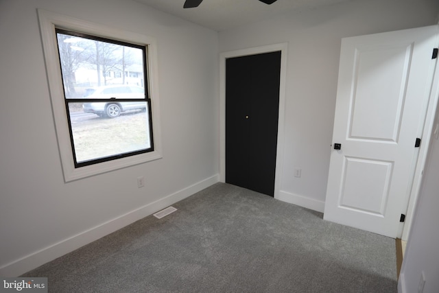 unfurnished bedroom featuring carpet flooring and ceiling fan