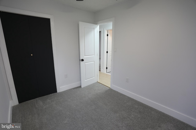 unfurnished bedroom with carpet flooring