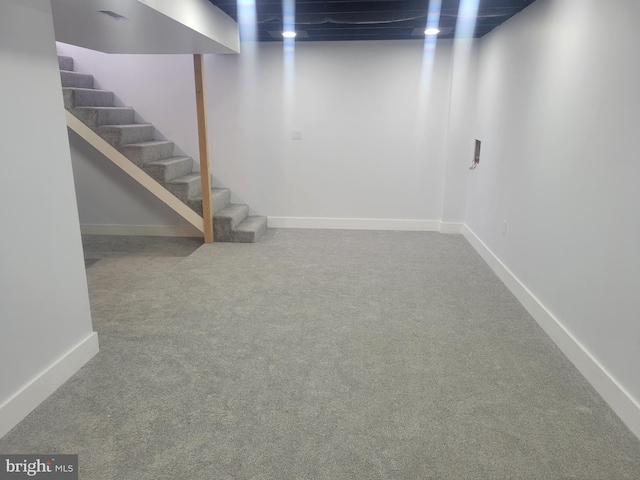 basement featuring carpet flooring