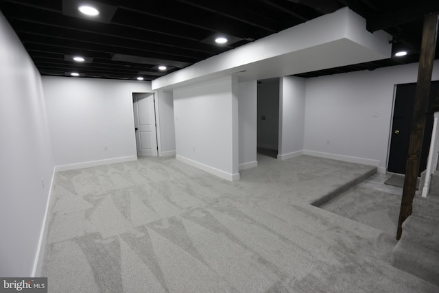 basement with light colored carpet