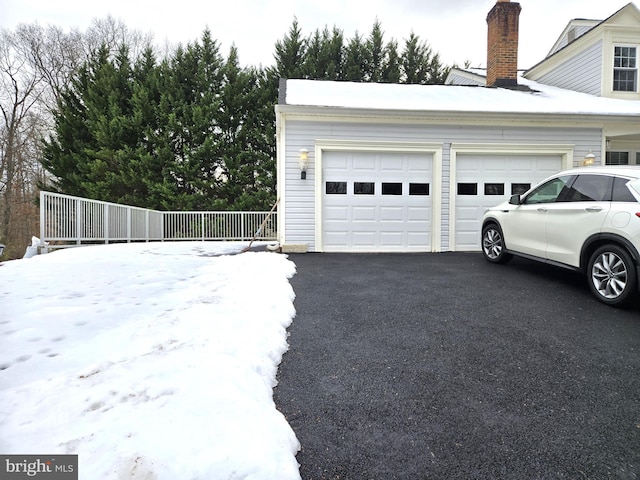 view of snow covered garage