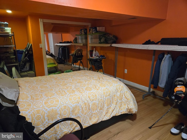 bedroom featuring a closet and hardwood / wood-style floors