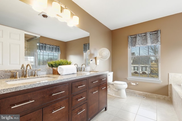 full bathroom with a wealth of natural light, visible vents, and a sink