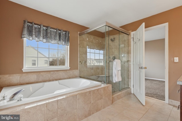 full bath with a garden tub, a shower stall, and tile patterned floors