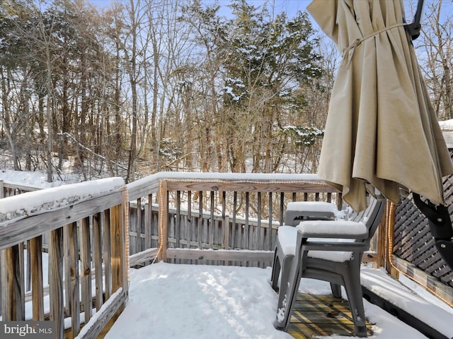 view of snow covered deck