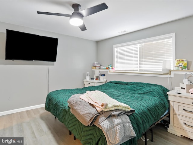 bedroom featuring ceiling fan and light wood-type flooring