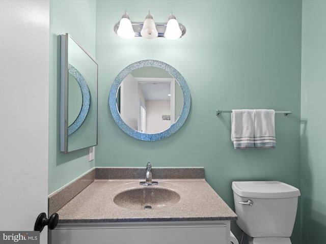 bathroom with vanity and toilet