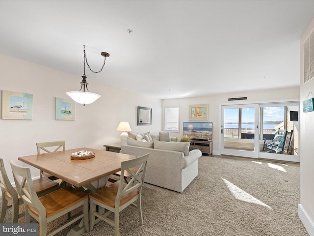 view of carpeted dining area