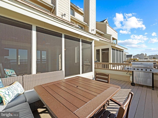 wooden deck with a grill