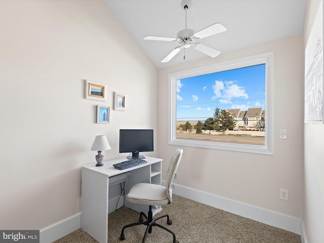 carpeted office featuring lofted ceiling and ceiling fan