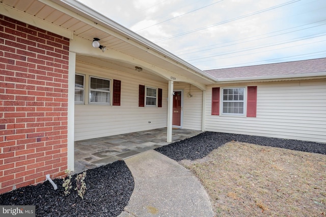 entrance to property with a patio area