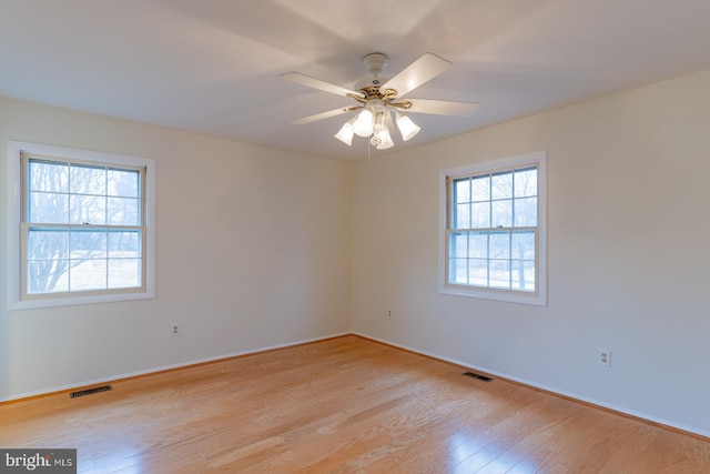 spare room featuring ceiling fan and light wood-type flooring