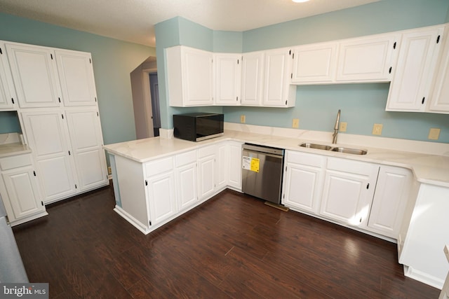 kitchen featuring white cabinets, kitchen peninsula, sink, and dishwasher