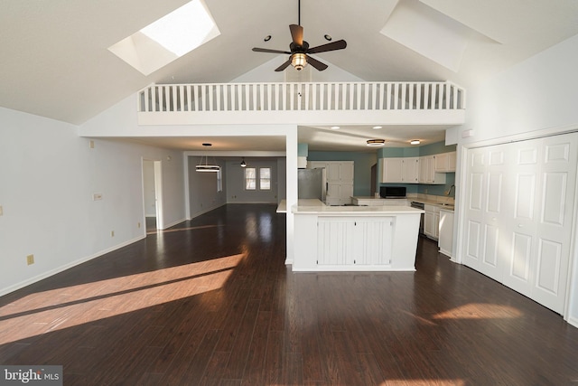 kitchen featuring white cabinetry, dark hardwood / wood-style flooring, stainless steel fridge, and ceiling fan