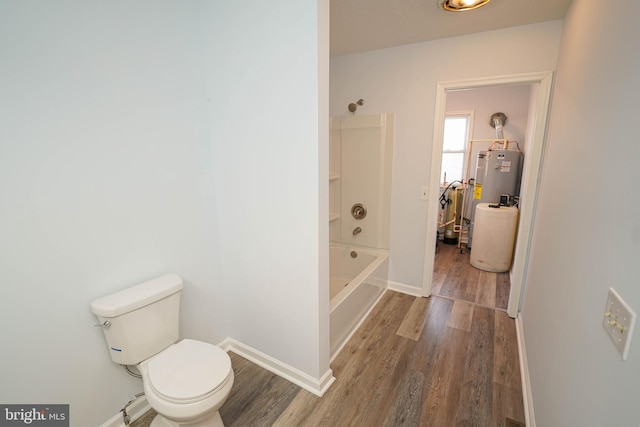 bathroom featuring bathtub / shower combination, wood-type flooring, toilet, and water heater