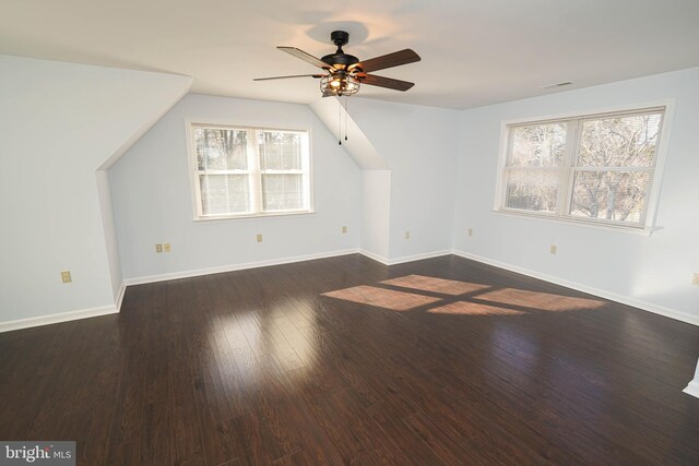 bonus room featuring ceiling fan, dark hardwood / wood-style floors, and vaulted ceiling