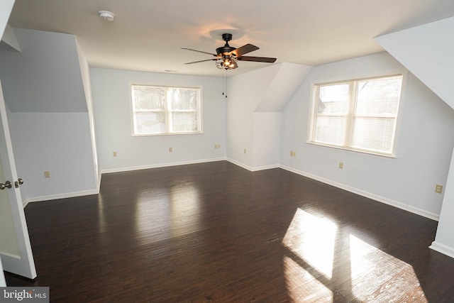 bonus room with lofted ceiling, dark wood-type flooring, and ceiling fan