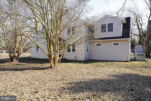 rear view of property featuring central air condition unit