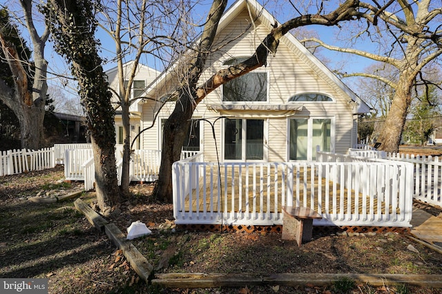 back of property featuring a deck