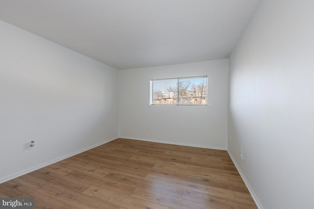 unfurnished room with light hardwood / wood-style floors