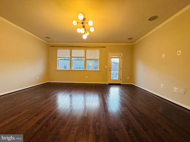 empty room featuring ornamental molding, a chandelier, and dark hardwood / wood-style flooring