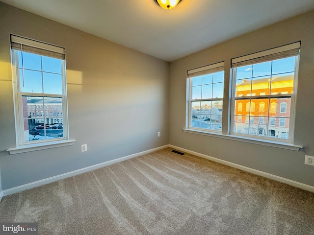 empty room featuring carpet flooring