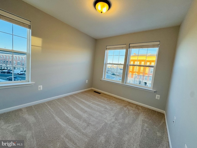 view of carpeted spare room