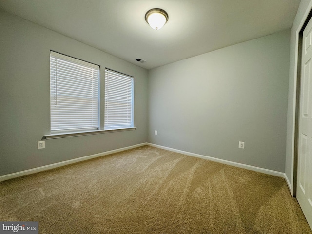 unfurnished room with carpet floors