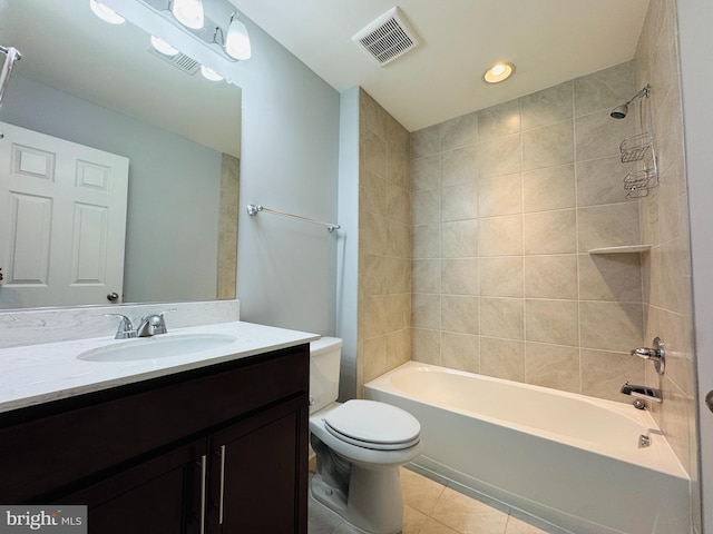 full bathroom with vanity, toilet, tiled shower / bath combo, and tile patterned flooring