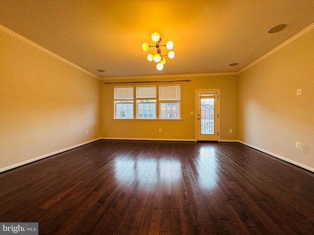 unfurnished room featuring an inviting chandelier, ornamental molding, and dark hardwood / wood-style floors