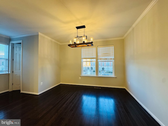 unfurnished dining area featuring ornamental molding, dark hardwood / wood-style flooring, and a chandelier