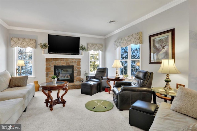 carpeted living room featuring ornamental molding and a stone fireplace