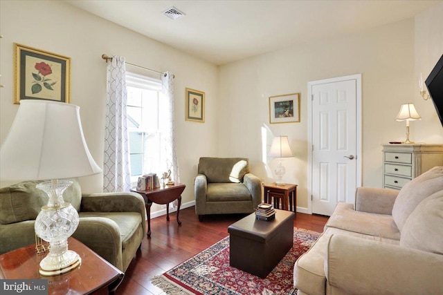 living room with dark hardwood / wood-style floors