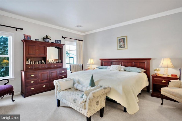 bedroom with ornamental molding and light colored carpet