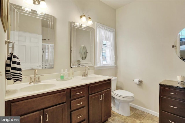 bathroom with toilet and vanity